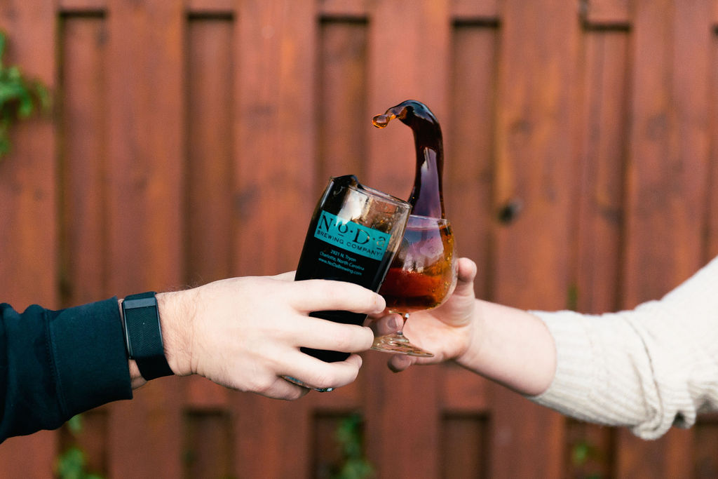 Guests toasting to great beer at NoDa Brewing Company