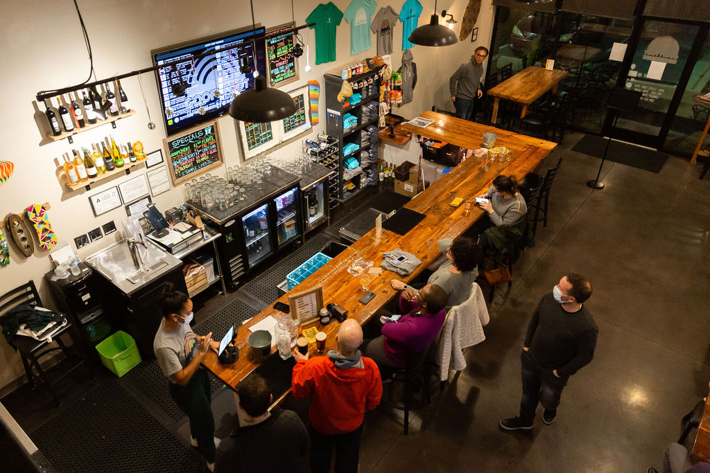 A top-down view of a crowded taproom