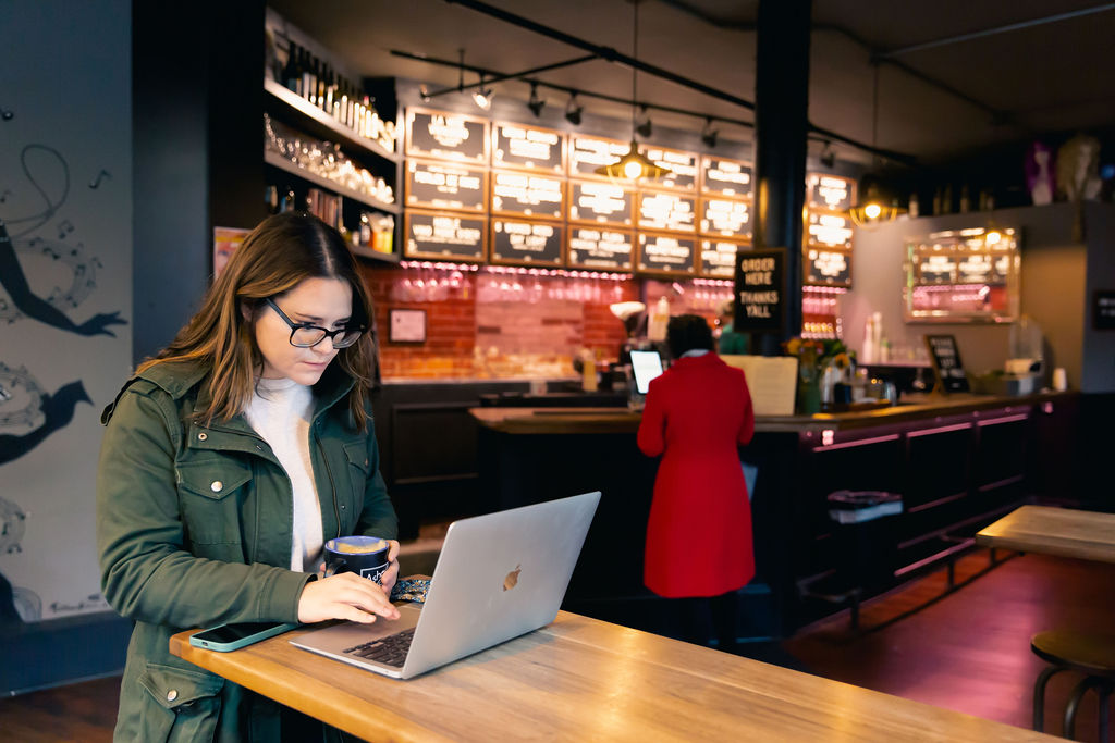 A women working through POS integrations on her laptop