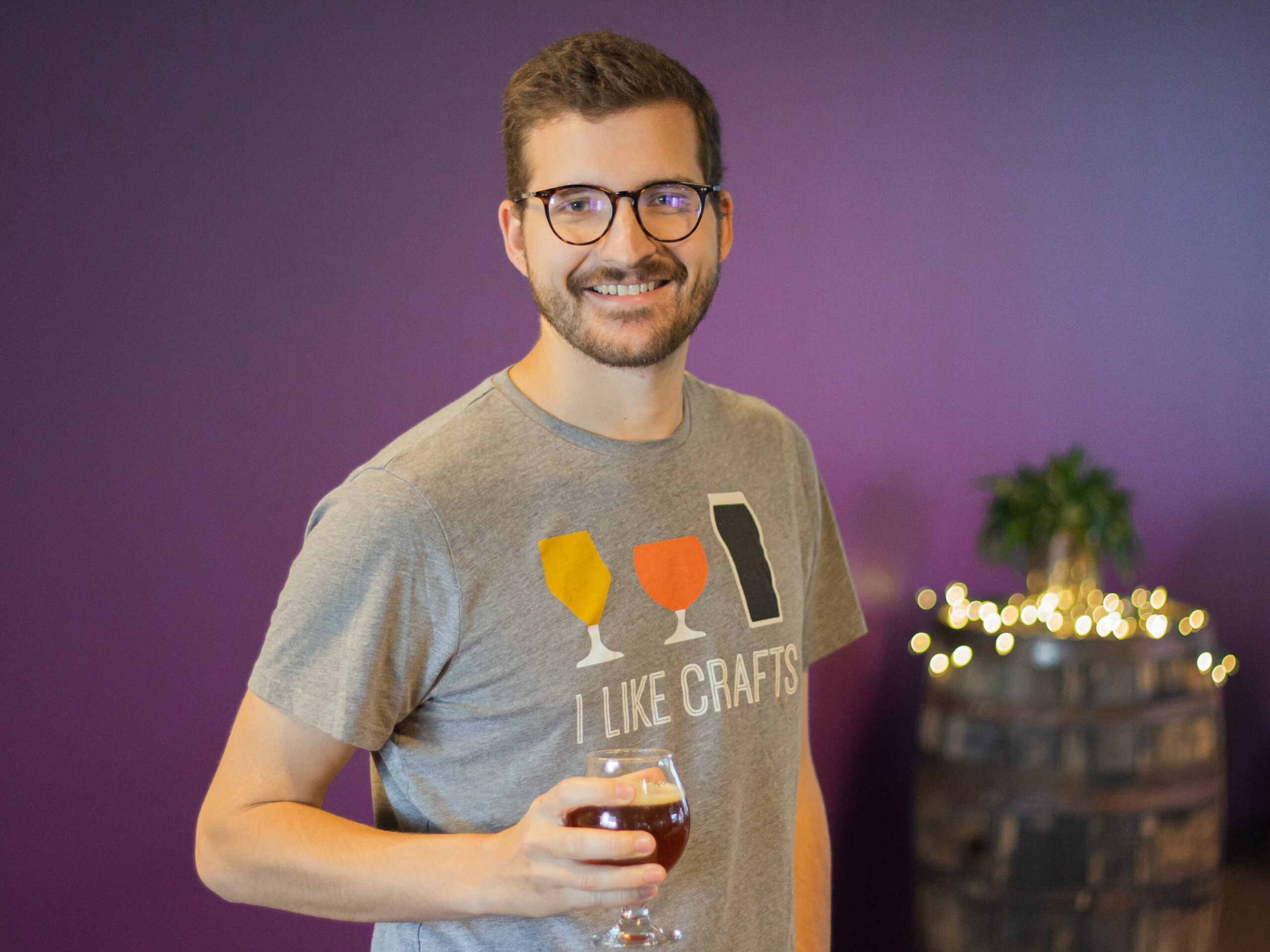 Andrew Carpenter holding a beer