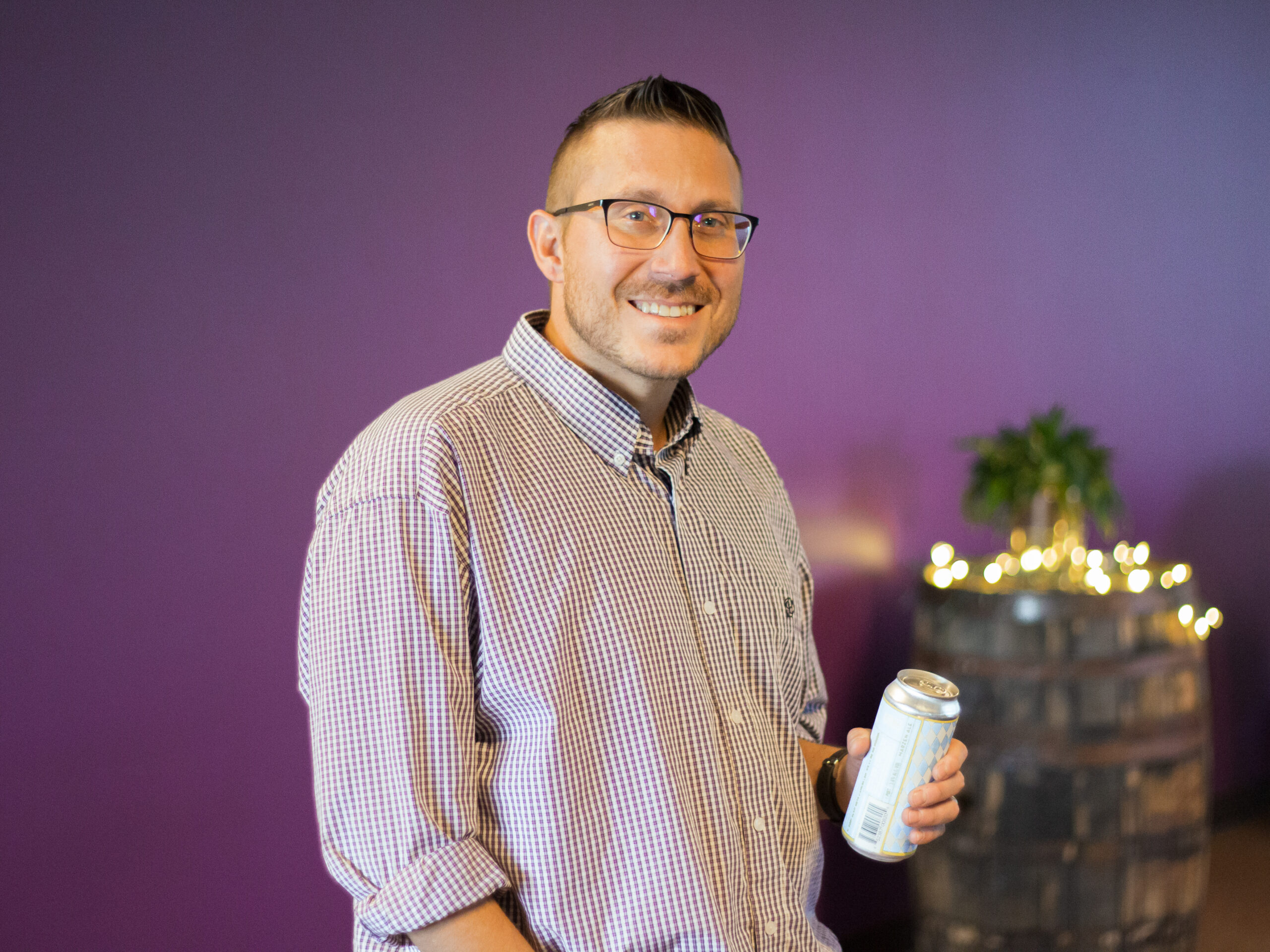 Ben Wolff holding a beer can