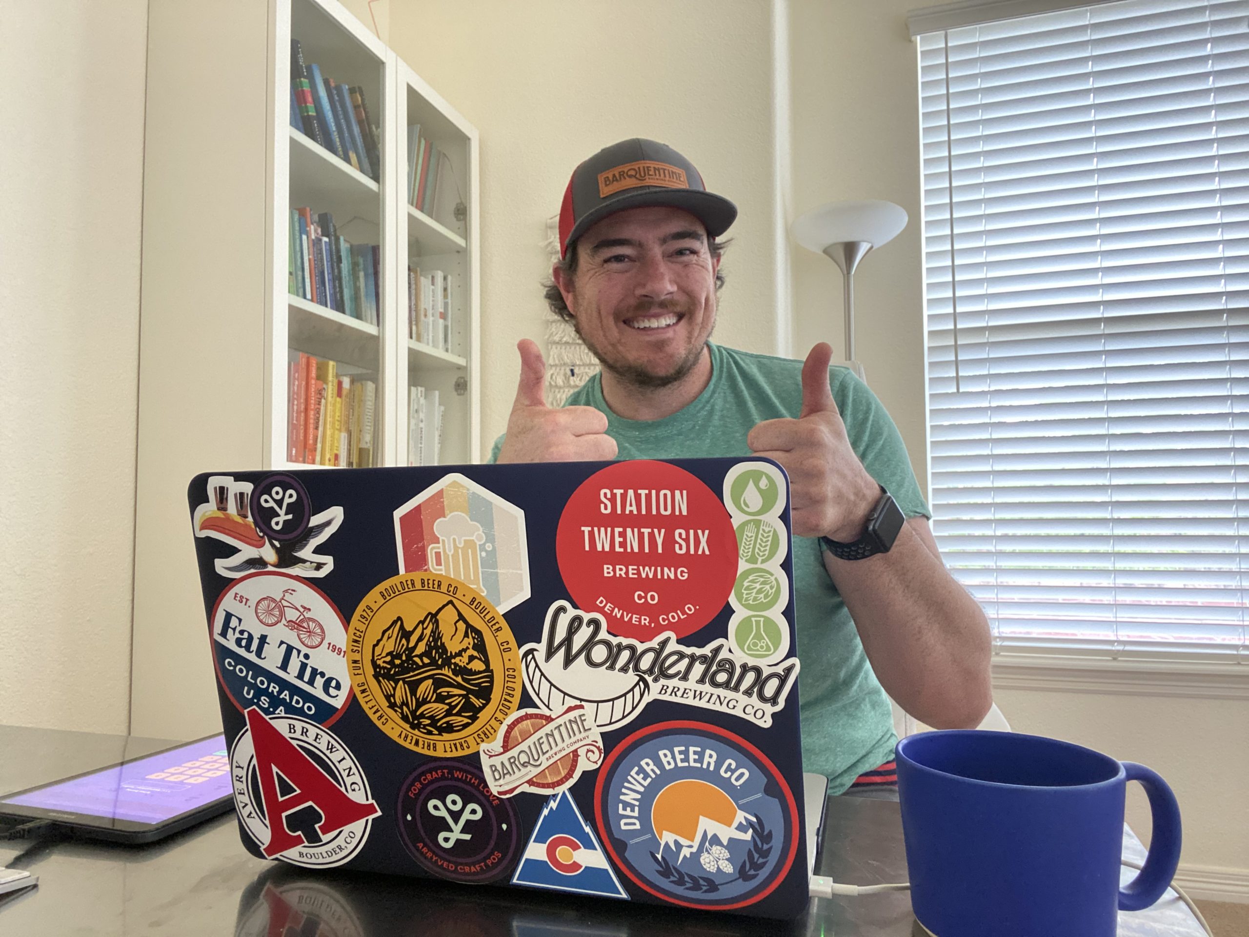 Arryved Product Education team member, Brian Jackson, at his computer with thumbs up