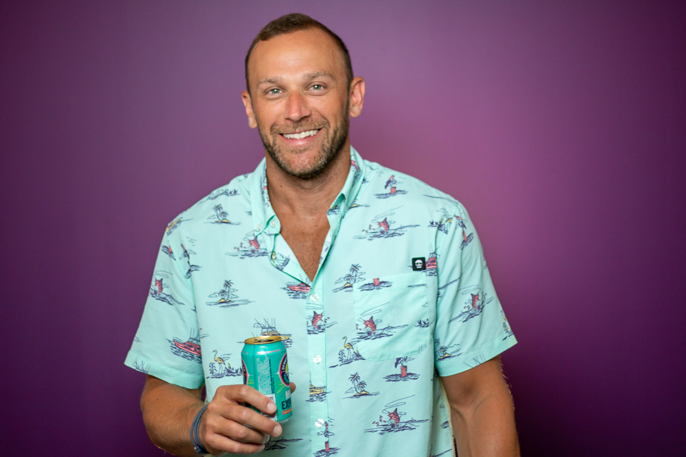 Mike Student holding a beer can