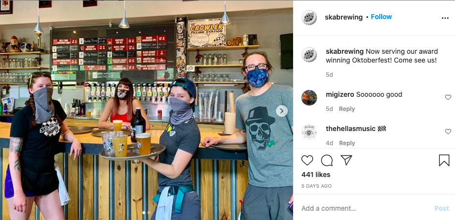 The team at Ska Brewing Company strike a masked pose in their beautiful taproom.